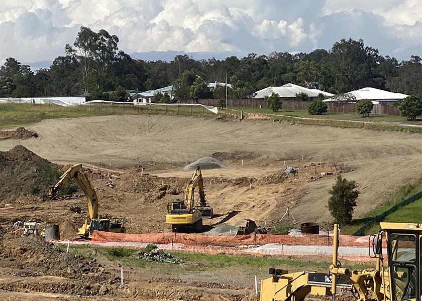 machinery working next to hydromulch slope